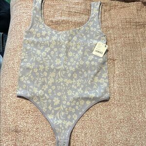 Free People Purple and White Shapewear Bodysuit
M/L. New with tags bodysuit NWT